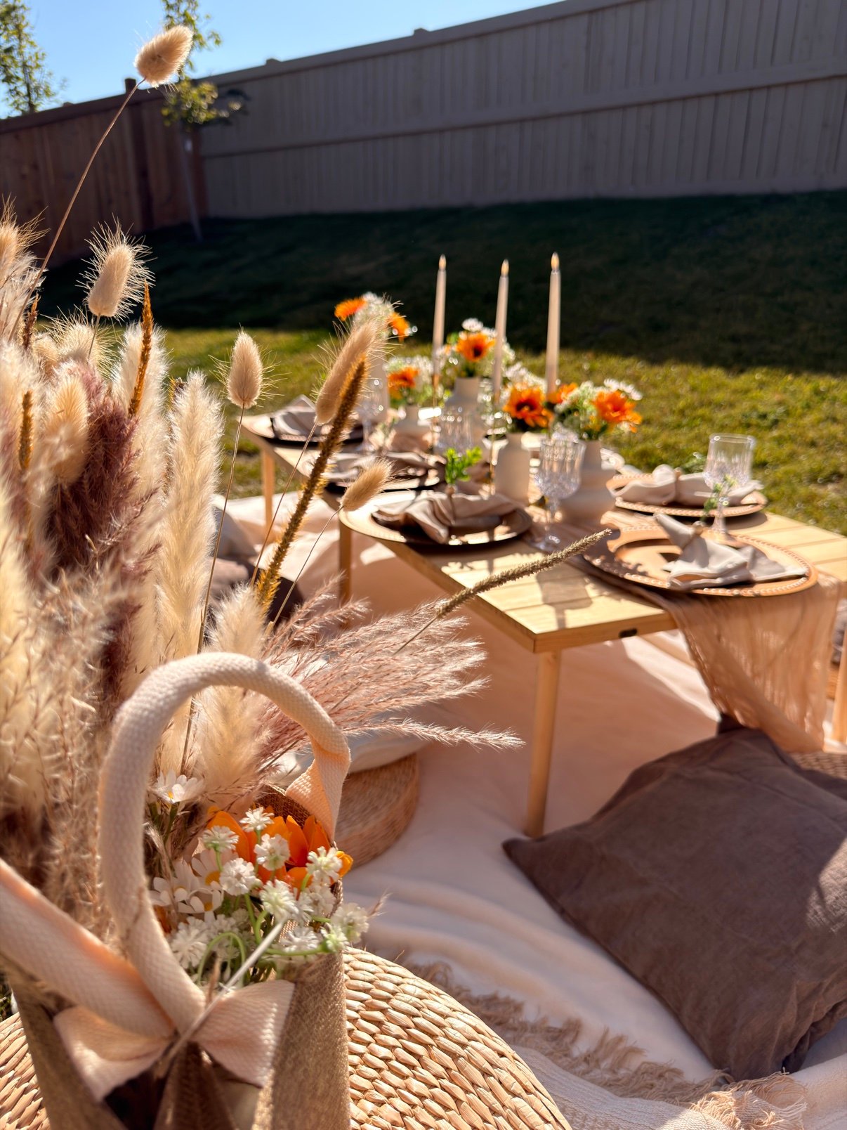 Boho picnic with pampas grass and orange flowers