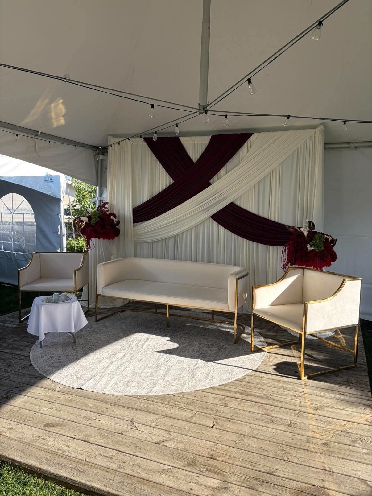 Burgundy draped backdrop by Penbaga Events