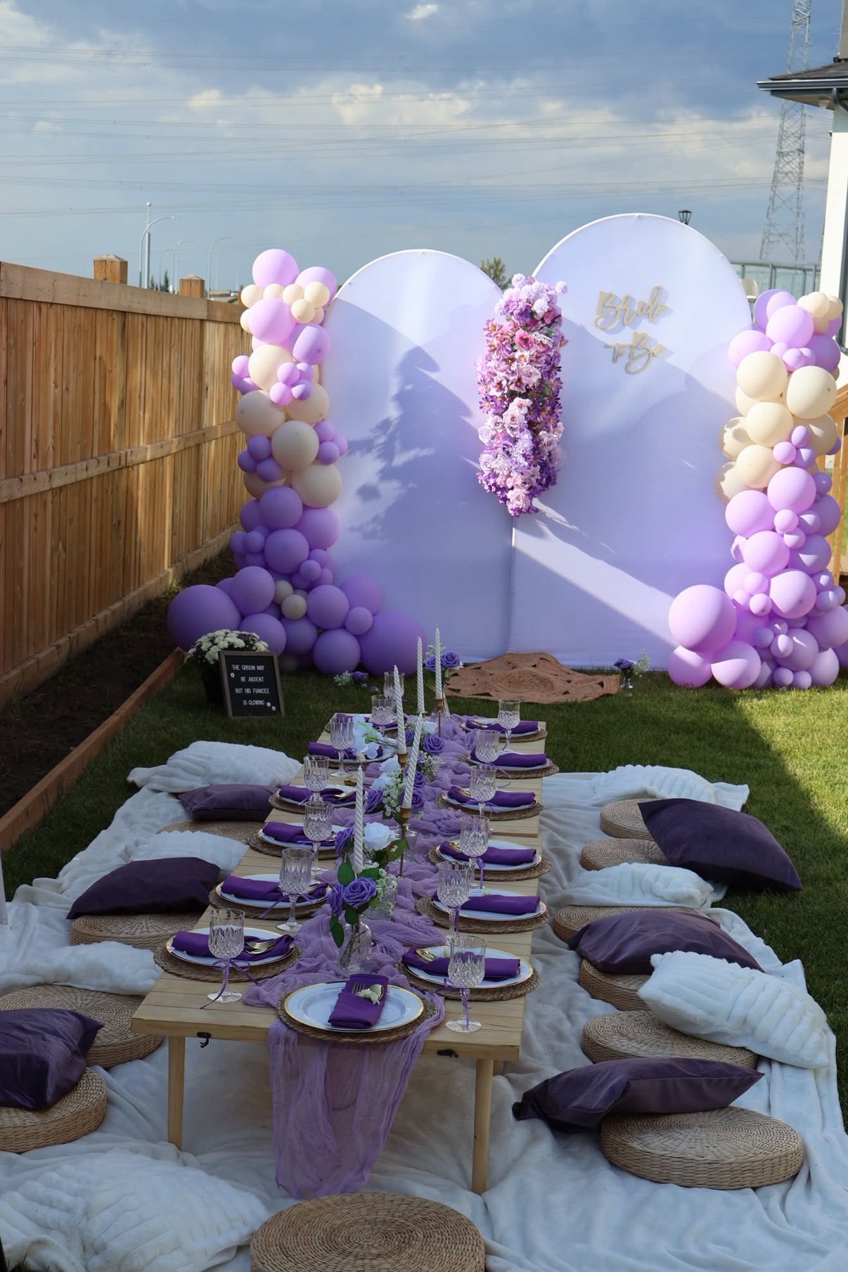 Pink guest-book table setup with florals by Penbaga Events