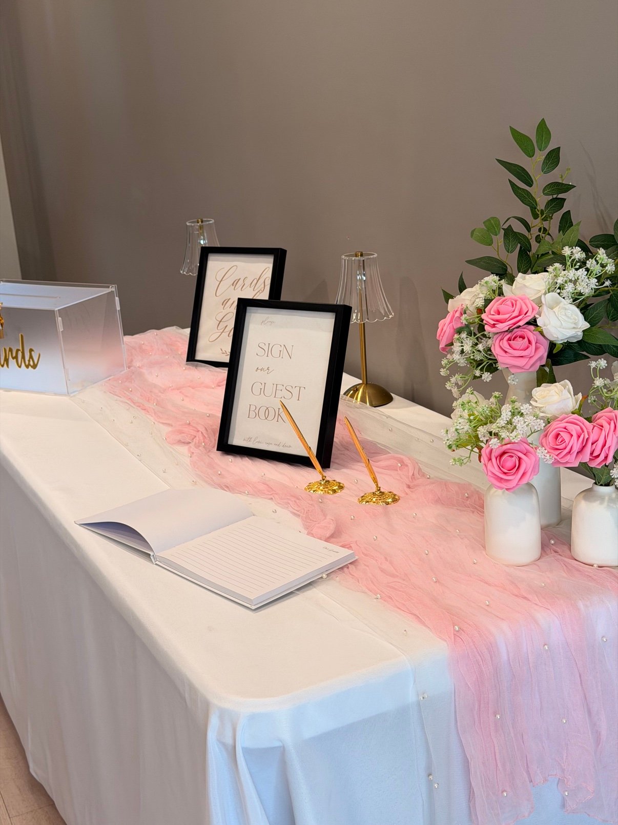 Outdoor tent reception with white florals by Penbaga Events